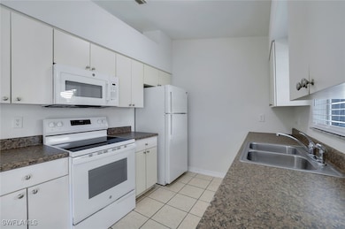 Kitchen featuring NEW white appliances