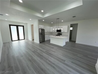 Kitchen featuring stainless steel appliances, open