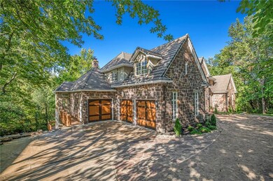 Estate sits on 1.175 acres with lots of trees and privacy. Slate roof, Hackett Stone front and heated driveway.