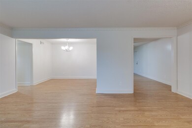 Unfurnished room featuring visible vents, ornament