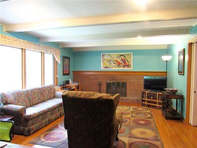 The family room also has a brick fireplace and  th
