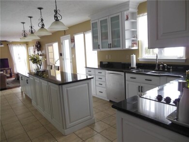 Newer kitchen with black granite countertops