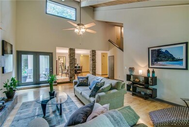 Another view of den looking into dining room and patio