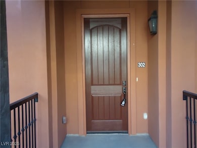 Property entrance with stucco siding