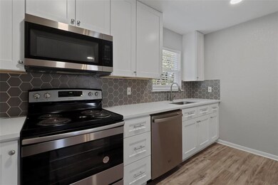 Kitchen, with new appliances and window view into 