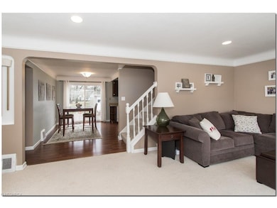Living Room Opens to Dining Room with Newer Lamina