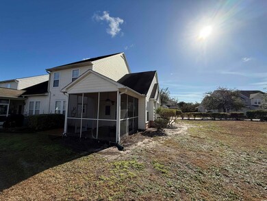 Back of property featuring a sunroom