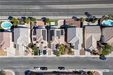 Aerial overview of property's location featuring nearby suburban area