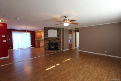 Family room has a cozy fireplace.