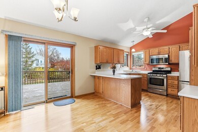 Sliding door with dog-proof screen for easy backyard access to the spacious deck and backyard