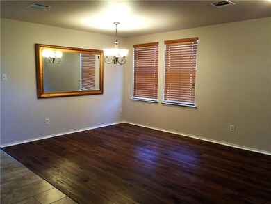Dining room. New wood flooring. New wall mirror.