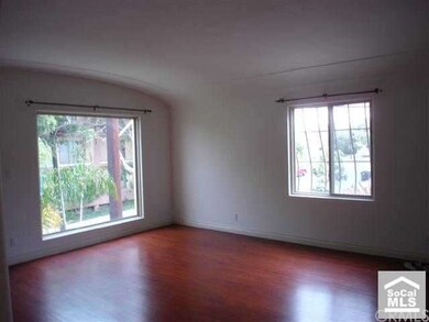 Living room with large windows facing East and Sou