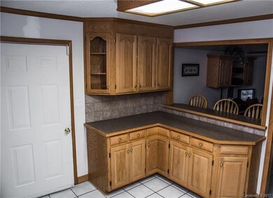 custom cabinetry w tile floor & backsplash