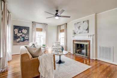 Living area with crown molding, ceiling fan, visib