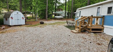 Parking area and storage shed