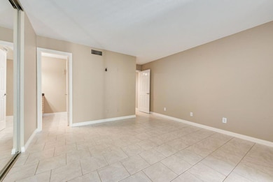 Unfurnished room with light tile patterned floors,