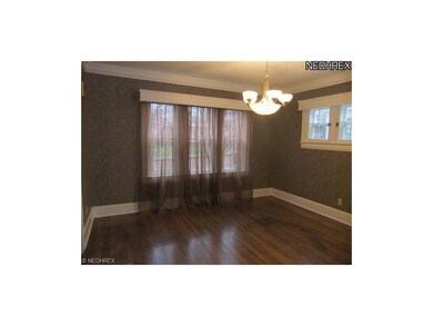 Hardwood floors flow into the dining room with cro