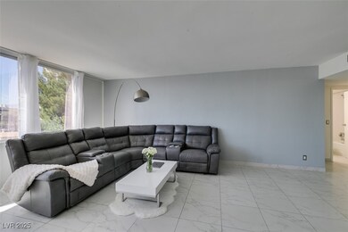 Living area with marble finish floor and baseboard