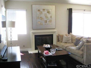 Fireplace and elegant hardwood floors in the livin