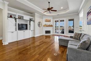Living room with wood finished floors, baseboards,