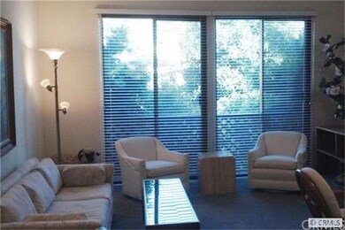 Living Room with view of trees and hills