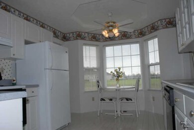 The large Kitchen is very cheerful! Offering a stove/oven, refrigerator, dishwasher, bay window w/eating area, & more!  Owners are also offering a $500 allowance for new Kitchen flooring!