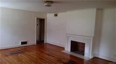 living room with marble fireplace