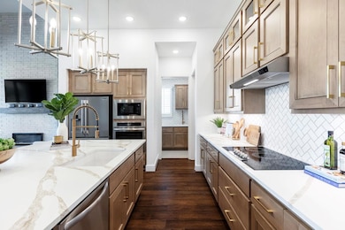 Kitchen with glass insert cabinets, a fireplace, 