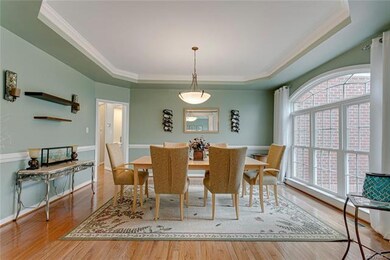 Dining room with beautiful windows, chair rail, an
