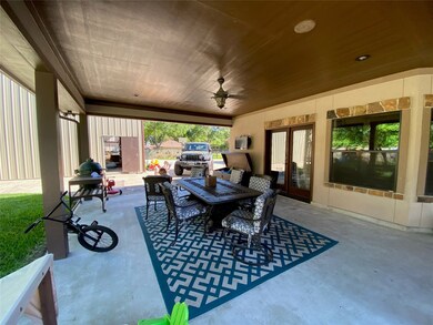 Outdoor dining area, with in ceiling speakers, area to hang a television, brand new led recessed can lights