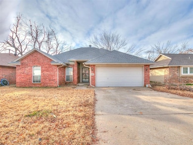 Ranch-style house with an attached garage, driveway, roof with shingles, and brick siding