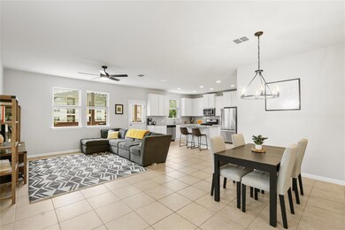 Dining room with light tile patterned flooring, b