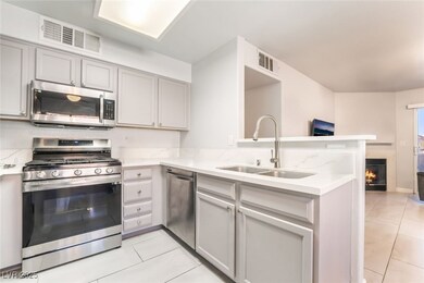 virtually decluttered: Kitchen featuring a peninsu