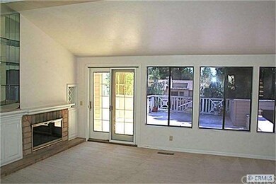Living Rm with high ceiling, fireplace, sliding do