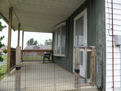 COVERED FRONT PORCH , GREAT TO RELAX ON.