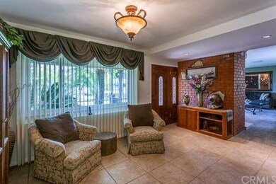 Formal dining room currently being used as a sitti