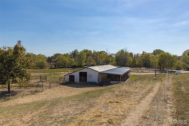 View of outdoor structure featuring a view of countryside and an exterior structure
