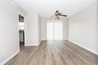 Unfurnished living room with baseboards, a ceiling