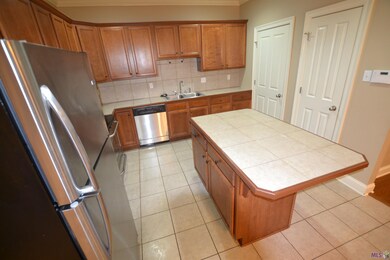 Laundry Room off kitchen next to the pantry.