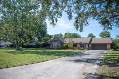 Front of home with view of long driveway with ampl