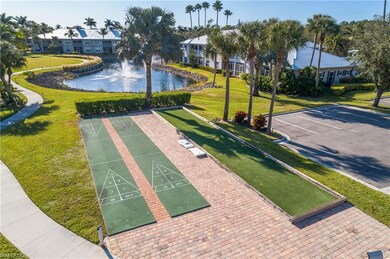 View of community with a water view and a lawn