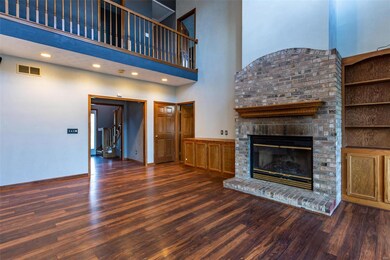 Wood Burning Fireplace and catwalk upstairs
