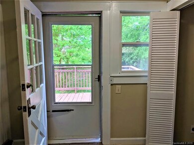 The laundry room with the doorway to the deck.