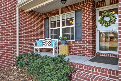 The front porch greets you and its houghtfully landscaped for the perfect curb appeal.
