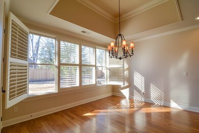Large windows with plantation shutters, unique tra