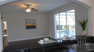 Looking from kitchen to family room and pool area.