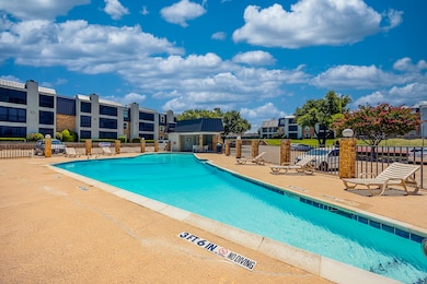 Community pool with a patio area