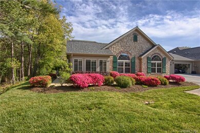 Wider view of side with woods on left/front of hom