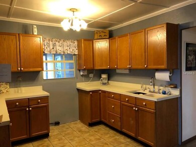 Kitchen with window view of out side.