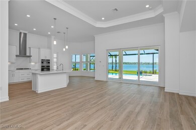 Kitchen with pendant lighting, wall chimney range